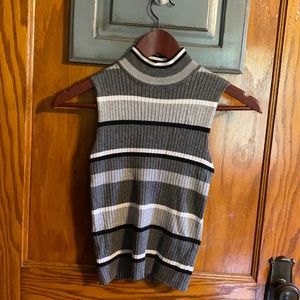 Grey, black, and white turtle neck, tank top.